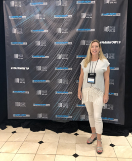 Bergen accepting the Hair Replacement Lifetime Achievement Award